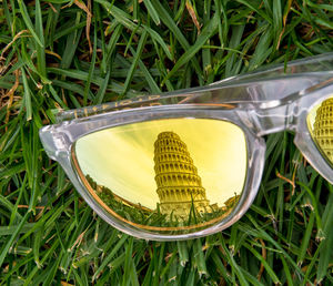 Close-up of sunglasses on grass