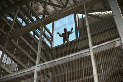 Low angle view of men working at construction site