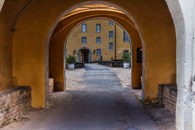 Empty alley amidst buildings