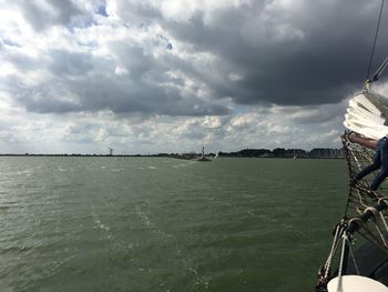 Scenic view of sea against cloudy sky