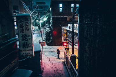 Illuminated city during winter at night