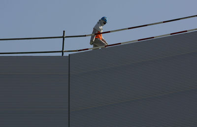 Construction worker walking on mall of the emirates