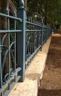 Metal gate against trees