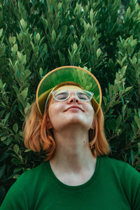 Portrait of young woman wearing sunglasses