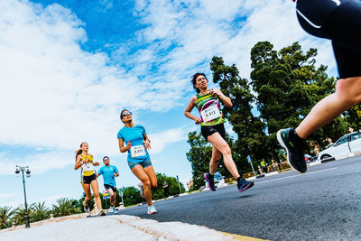 Low angle view of people running