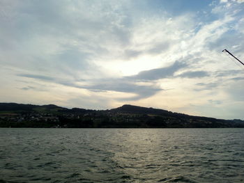 Scenic view of sea against cloudy sky