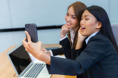 Woman using laptop on table