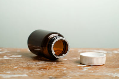 Close-up of glass bottle on table