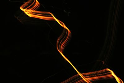 Light trails over black background