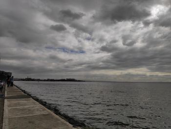 Scenic view of sea against cloudy sky
