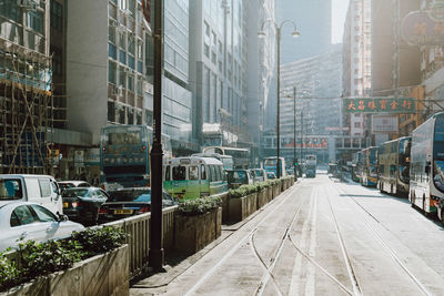 Street amidst buildings in city during winter