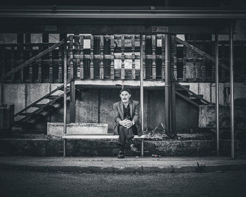 Rear view of man sitting in park