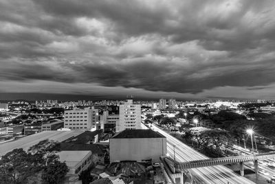 High angle view of cityscape against storm clouds