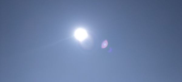 Low angle view of moon against clear sky at night
