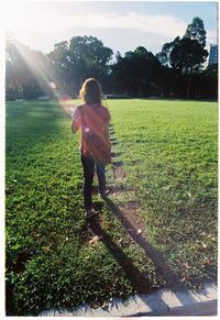 Full length of man standing on grassy field