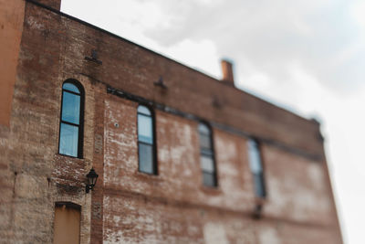 Low angle view of old building against sky