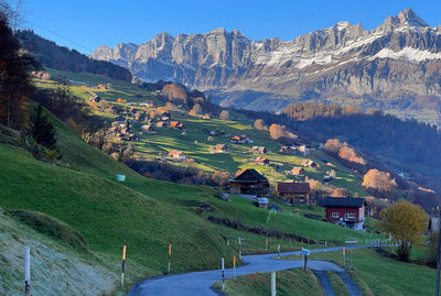 High angle view of houses and mountains against sky