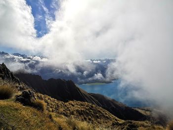 Scenic view of mountain against sky and clouds