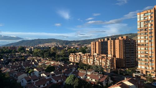 High angle view of buildings in city against sky