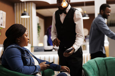 Side view of business colleagues working in office