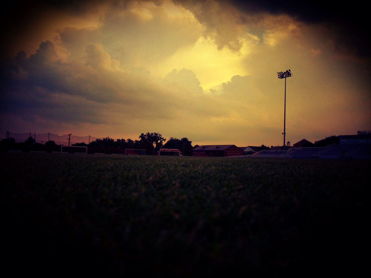 sky, sunset, field, landscape, cloud - sky, tranquil scene, tranquility, silhouette, scenics, nature, beauty in nature, street light, cloud, dusk, rural scene, outdoors, cloudy, no people, tree, building exterior