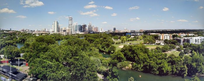 High angle view of trees and buildings against sky