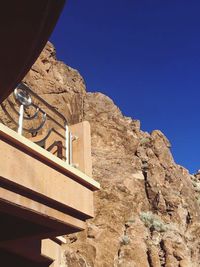 Low angle view of built structure against clear blue sky