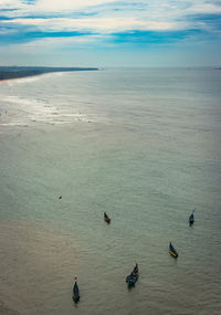 Beach isolated with fishing boats aerial shots with dramatic sky