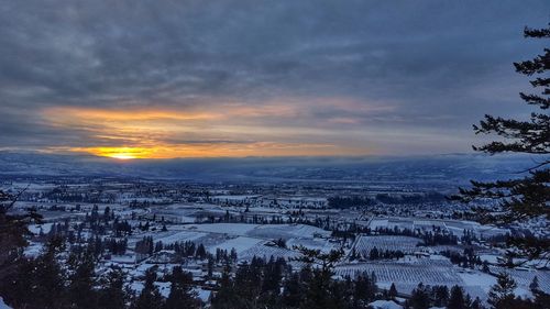 Aerial view of city during sunset