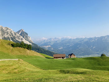 Scenic view of mountains against clear blue sky