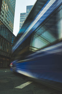 Blurred motion of street and buildings in city