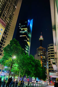 Low angle view of illuminated buildings at night