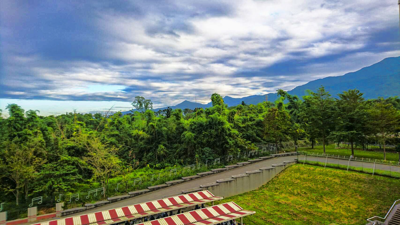 VIEW OF WINDING ROAD AGAINST SKY