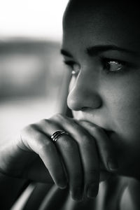 Close-up of sad woman while looking away