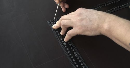 Cropped hand of person holding paper