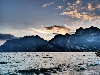Scenic view of snowcapped mountains against sky during sunset
