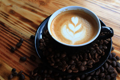 High angle view of cappuccino on table