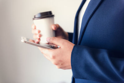 Close-up of man using mobile phone