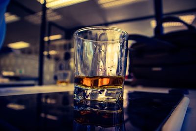 Close-up of beer glass on table