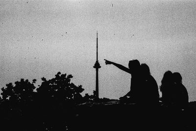 Silhouette people standing against white background