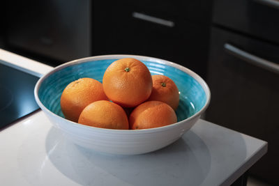 High angle view of oranges in bowl at home 