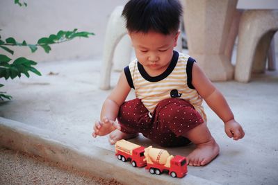 Cute boy playing with toy