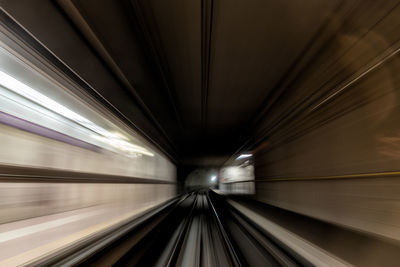 Blurred motion of train at railroad tunnel