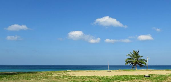 Scenic view of sea against blue sky