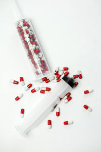 High angle view of colored pencils on white background
