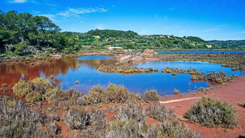 Scenic view of lake against blue sky