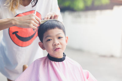 Portrait of mother and daughter outdoors
