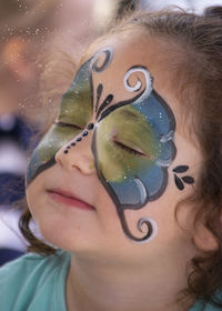 Close-up of cute girl with painted face