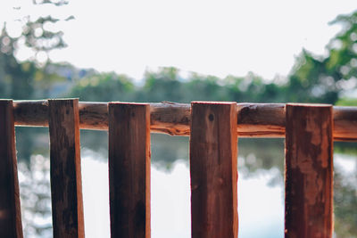 Close-up of wooden fence against sky