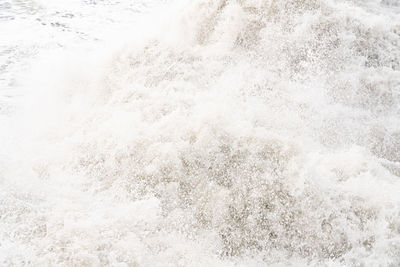 High angle view of wave splashing on shore